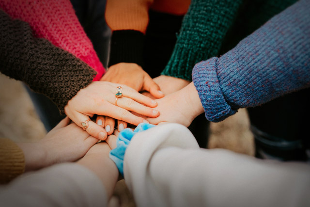 group of hands holding